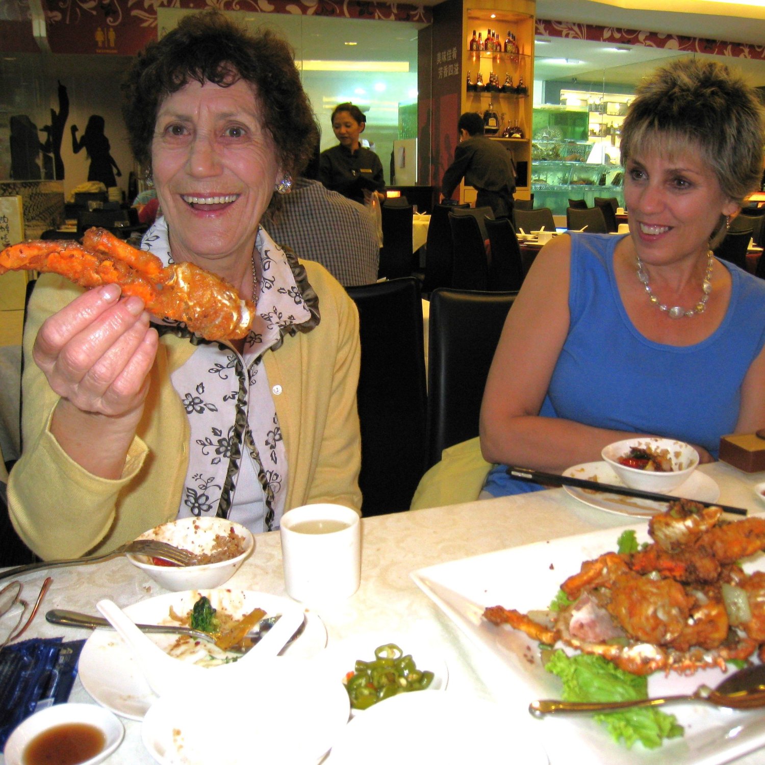 Marlene with her Mother in Singapore, enjoying chilli crab, 2008