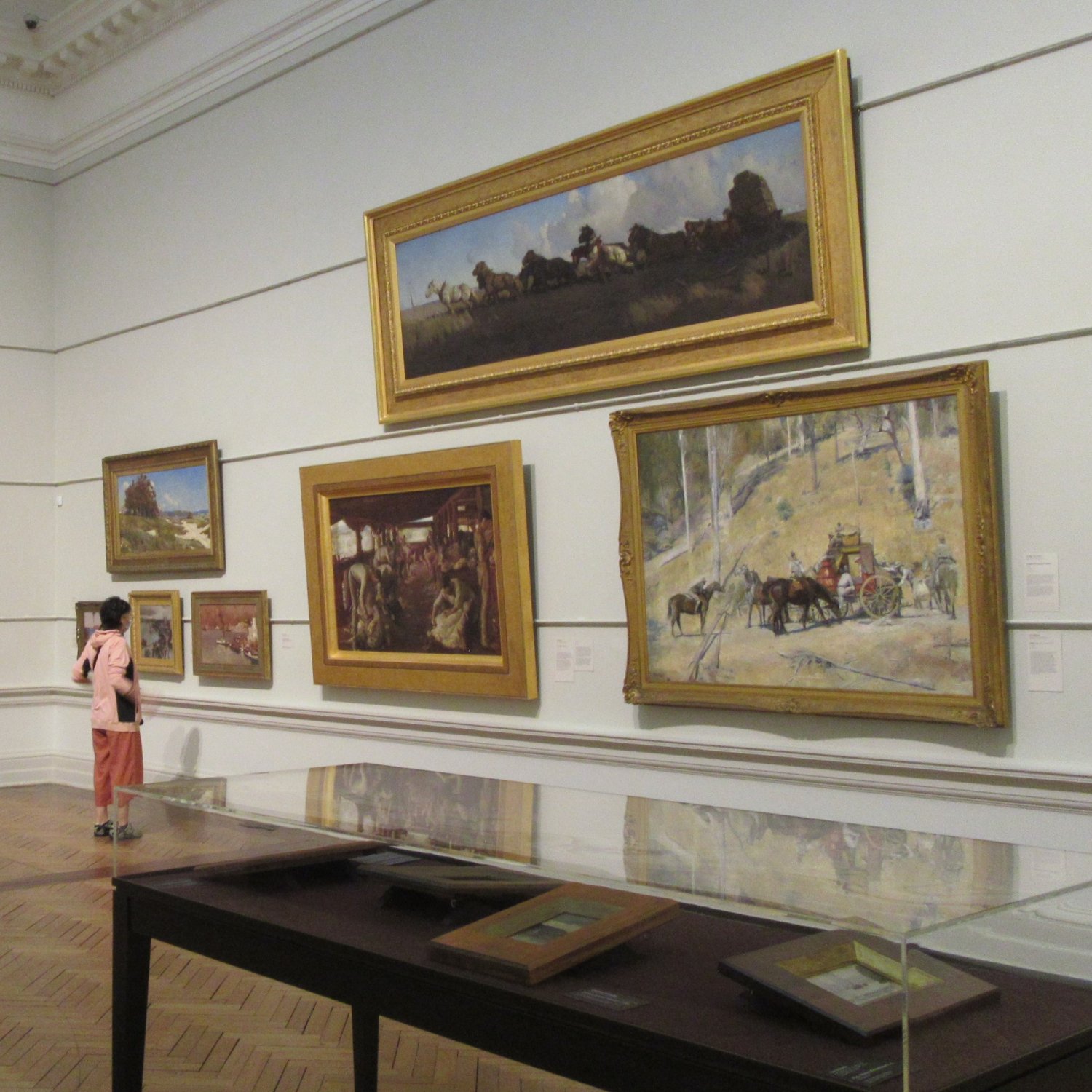 Inside the Art Gallery of New South Wales, a visitor is admiring part of the display