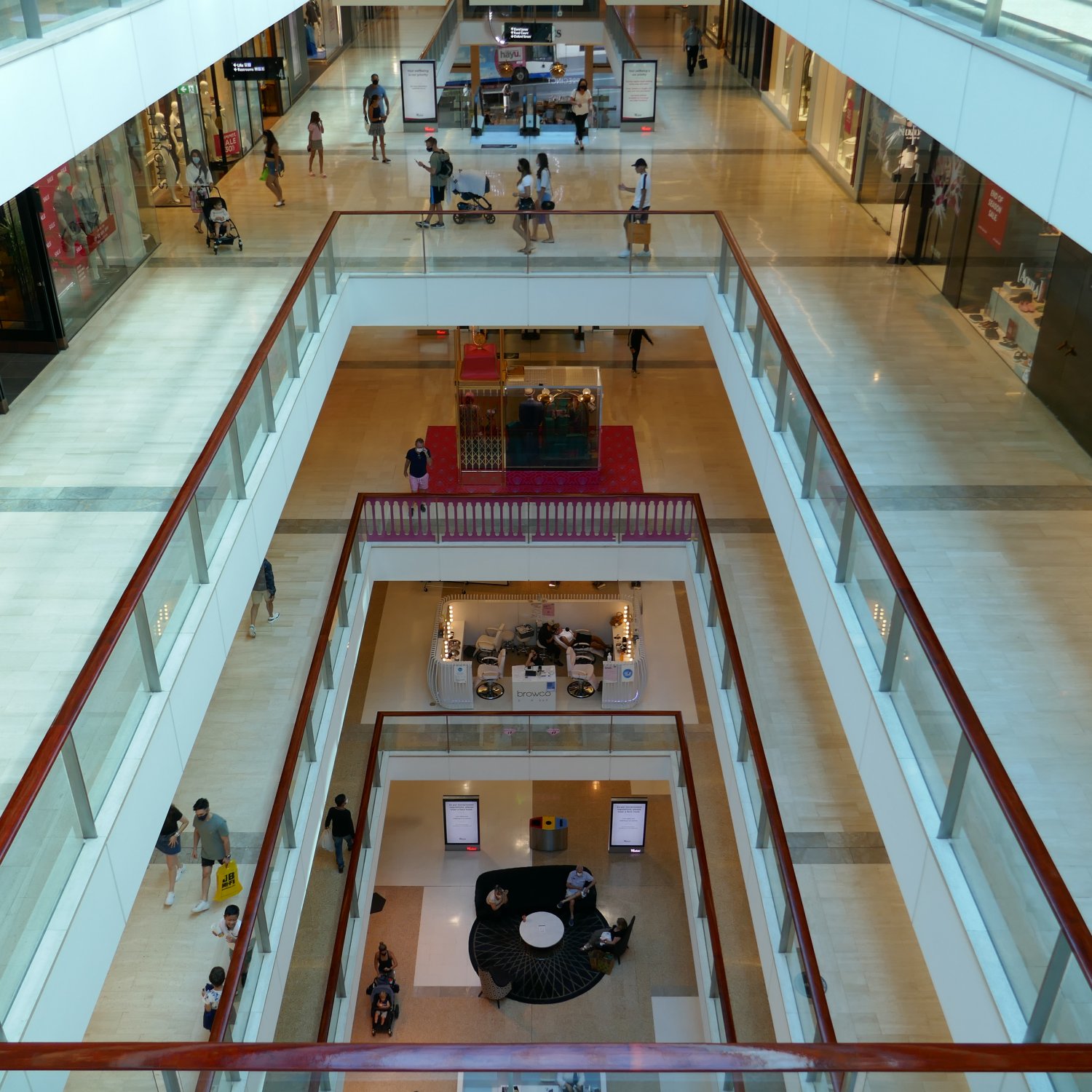 A view of the inside of the Westfield Bondi Junction shopping complex, looking from an upper level, down through the open floors