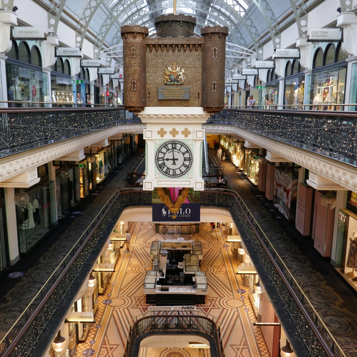 An internal view of Sydney's Queen Victoria Building from an upper level, looking down through the open centre of the building