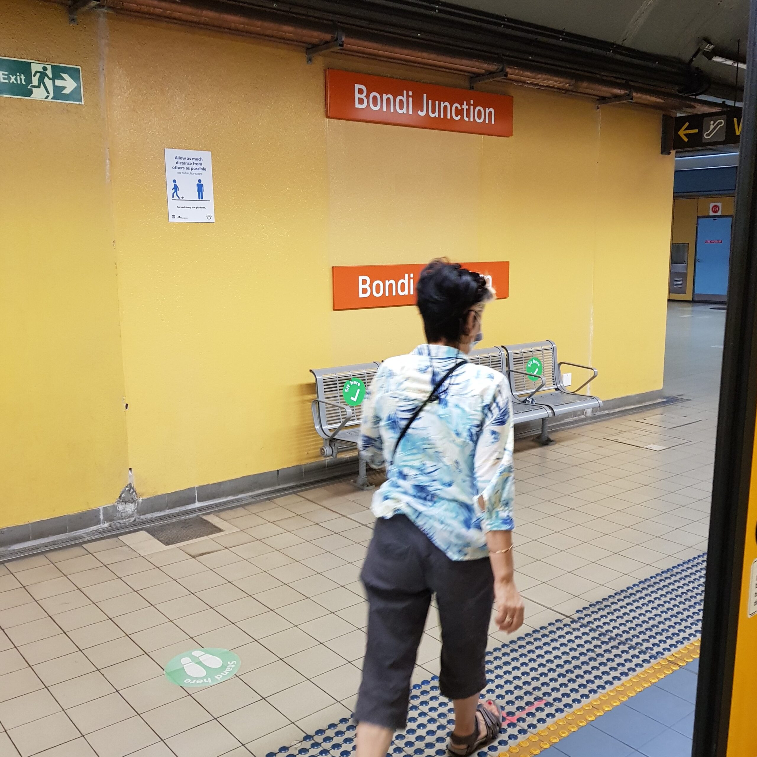 a passenger exiting the train at Bondi Junction, intending to catch a bus to Bondi Beach