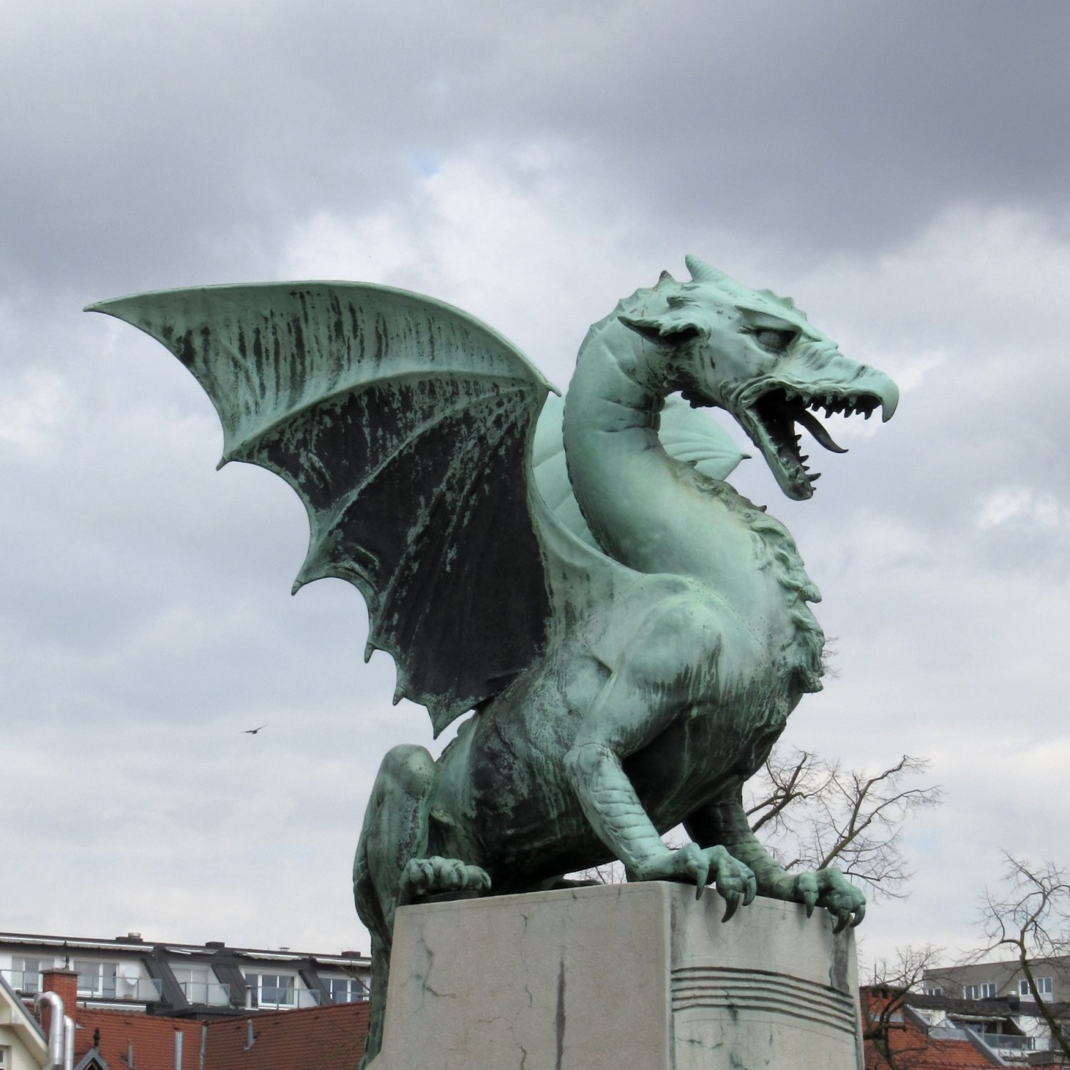 A Green Dragon, frozen in bronze, at the Dragon Bridge
