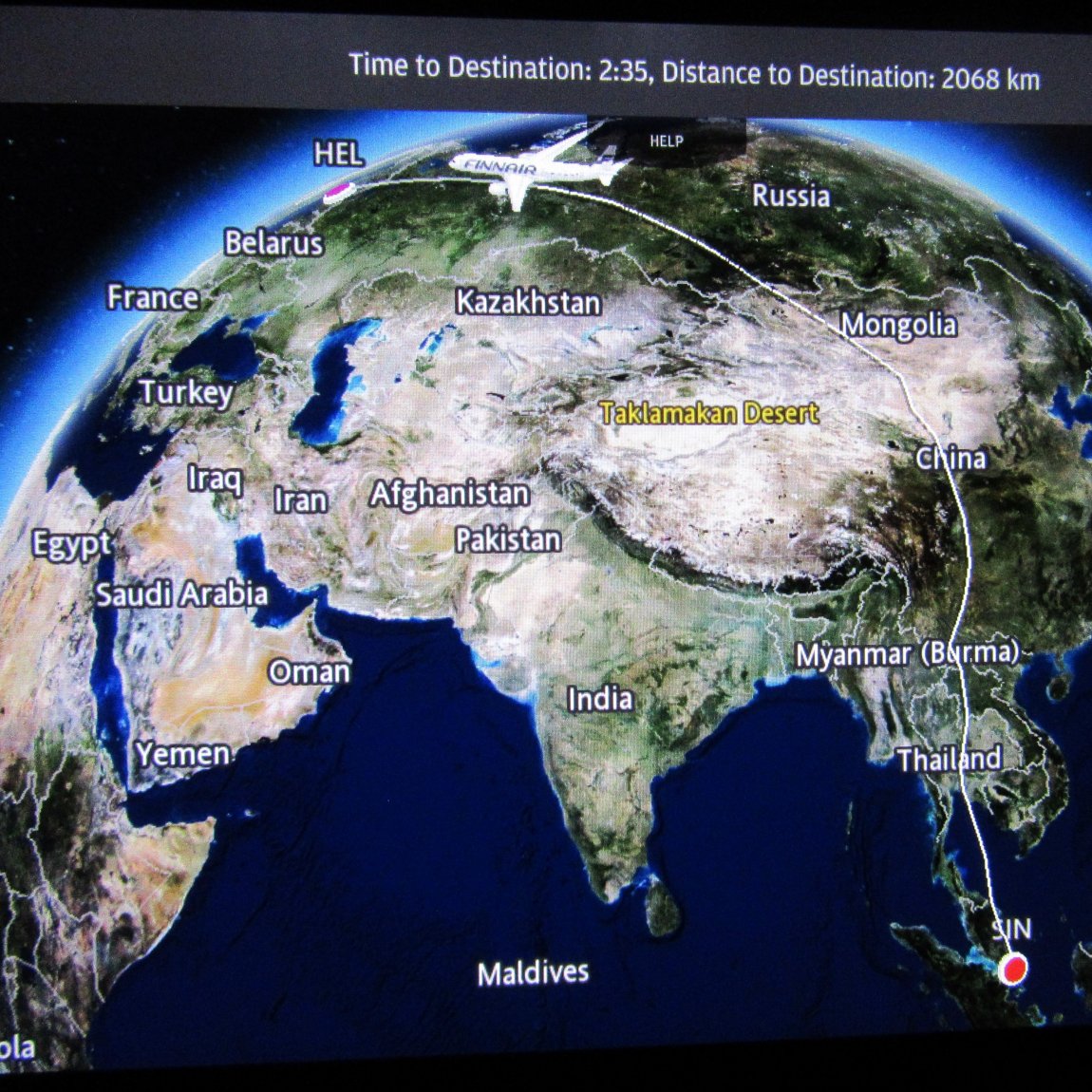 Image of flight path, displayed on a screen, for a 13½ hour journey from Singapore to Helsinki