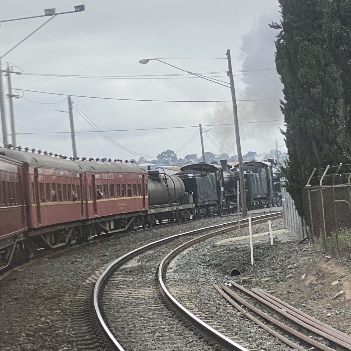 An image taken from a rear passenger carriage showing the Steamrail train taking the bend at North Geelong