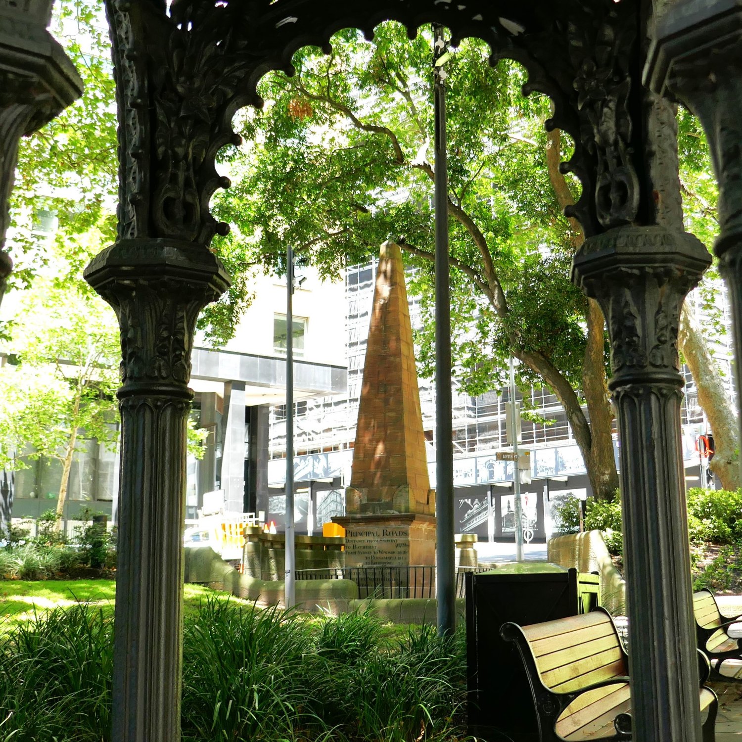 Image of the Macquarie Obelisk of Distances, framed by the Canopy Fountain