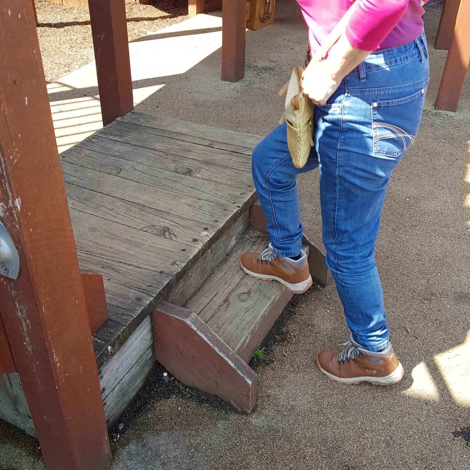 image of a person's legs doing step-ups 0n two wooden steps