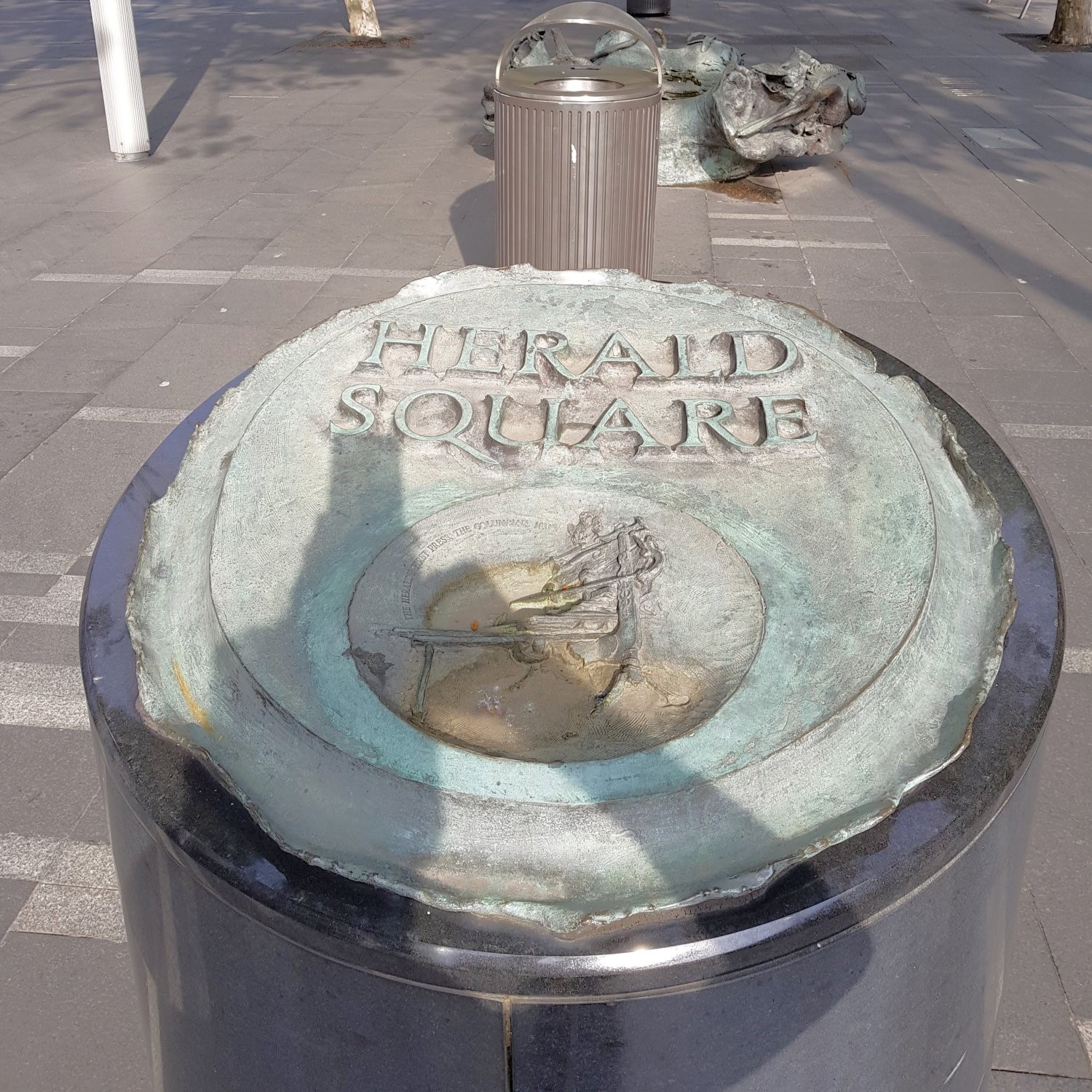 Image of the bronze sculpture which is at each end of the Tank Stream Fountain, in Herald Square