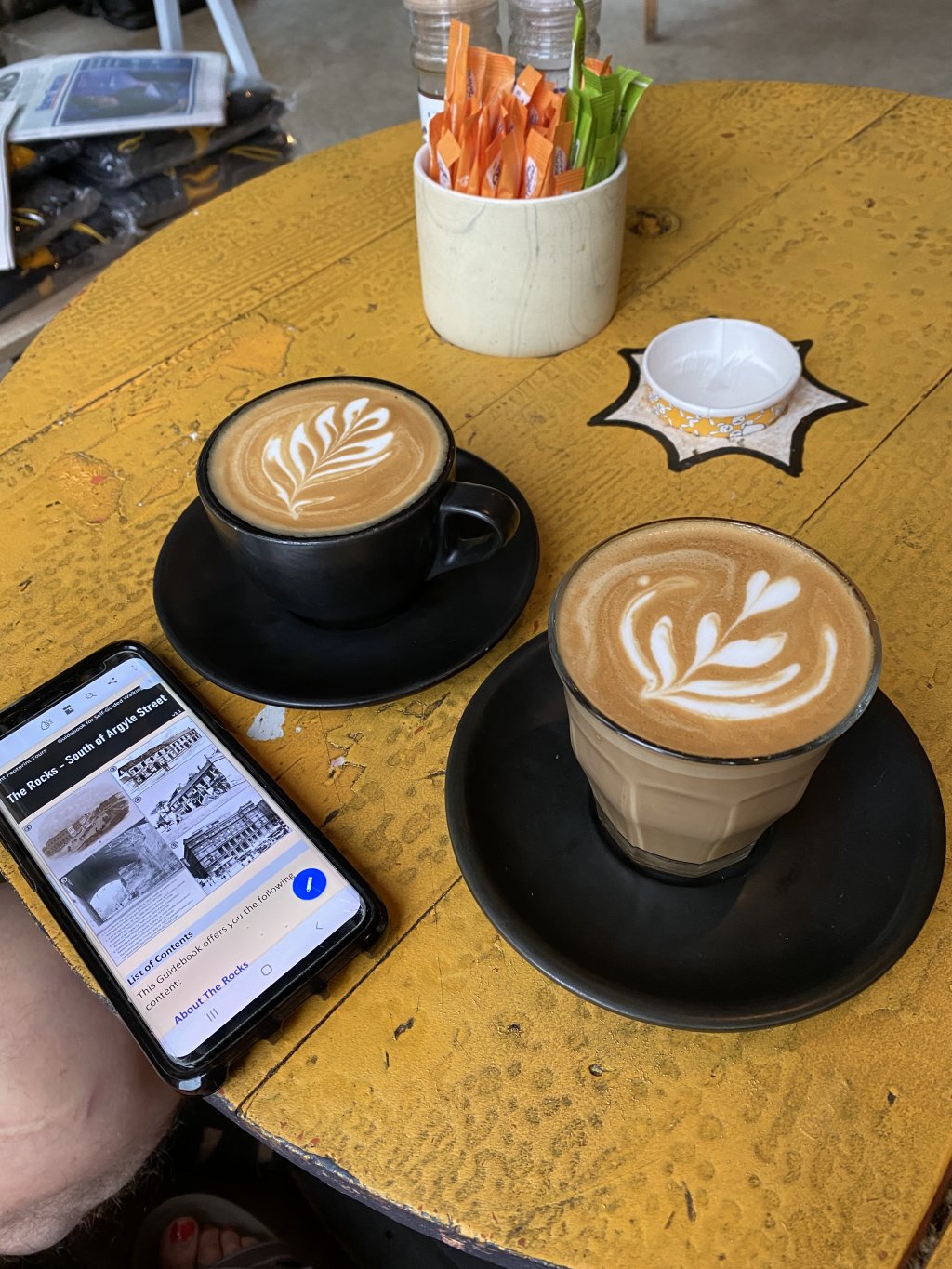 image of two coffee cups on a table top, at Darlinghurst