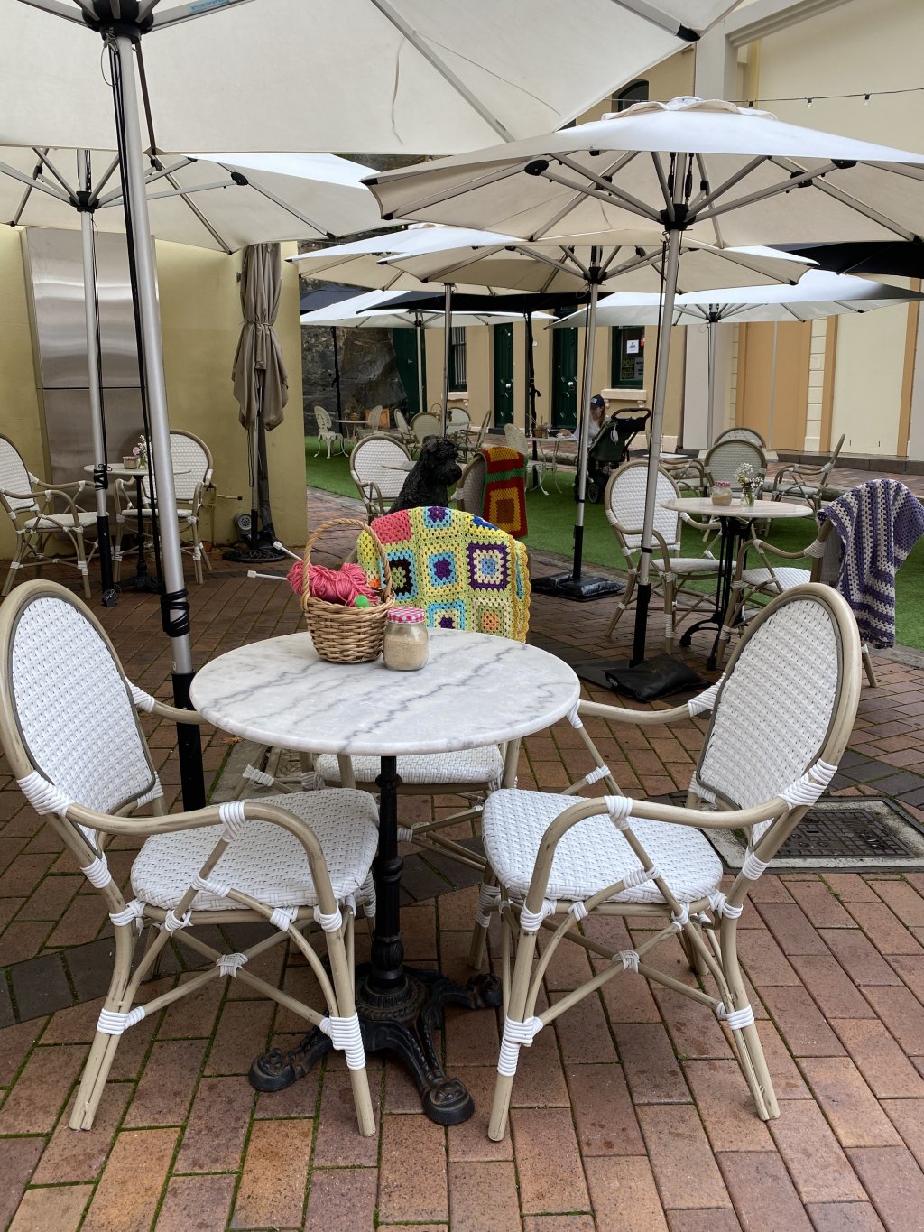image of an outdoor dining scene, under unbrellas, at The Rocks