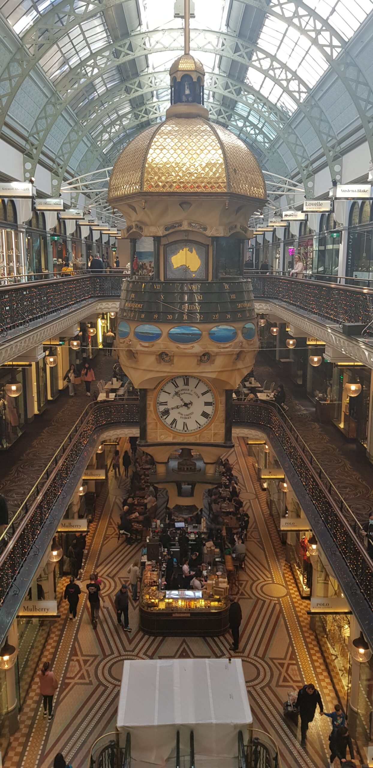 image of several floors inside QVB, Sydney, with the Great Australian Clock in the foreground