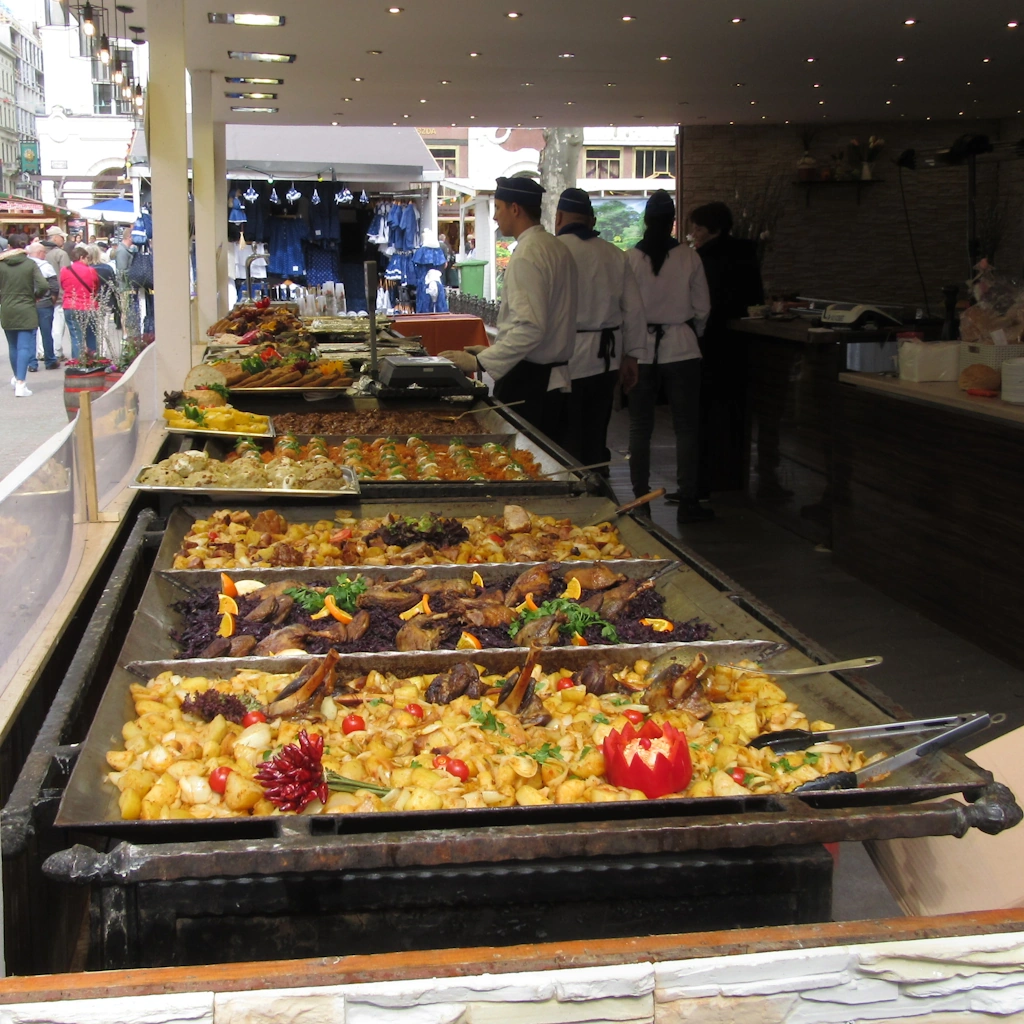 Image of a market food stall in Budapest, with several trays of hot food on display