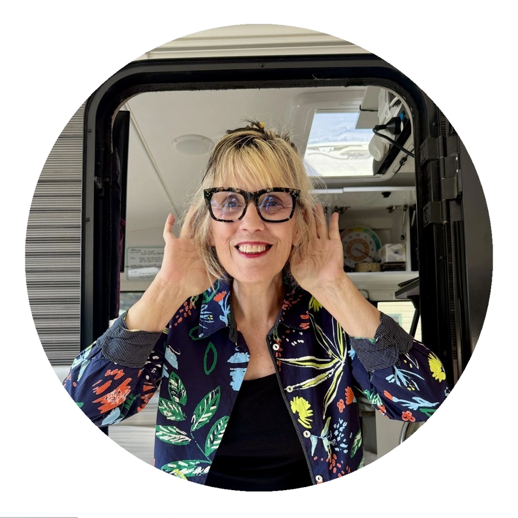 Marlene with ahnds by her ears, listening