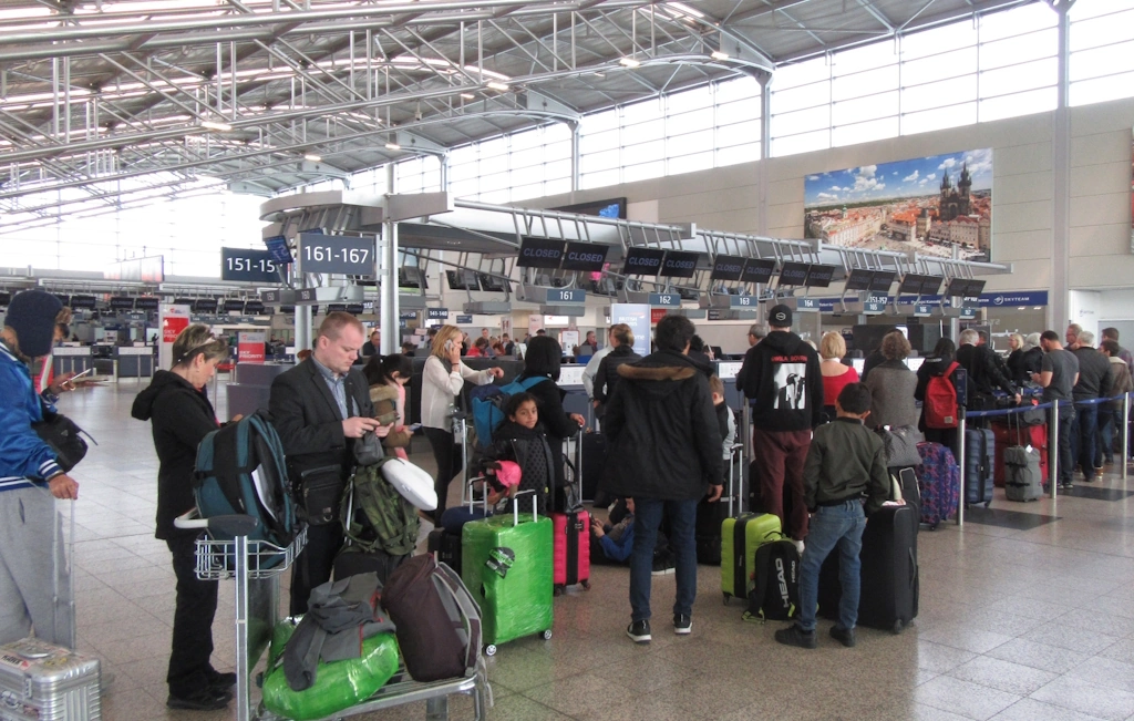 image showing a check-in queue of passengers at Prague's Václav Havel Airport