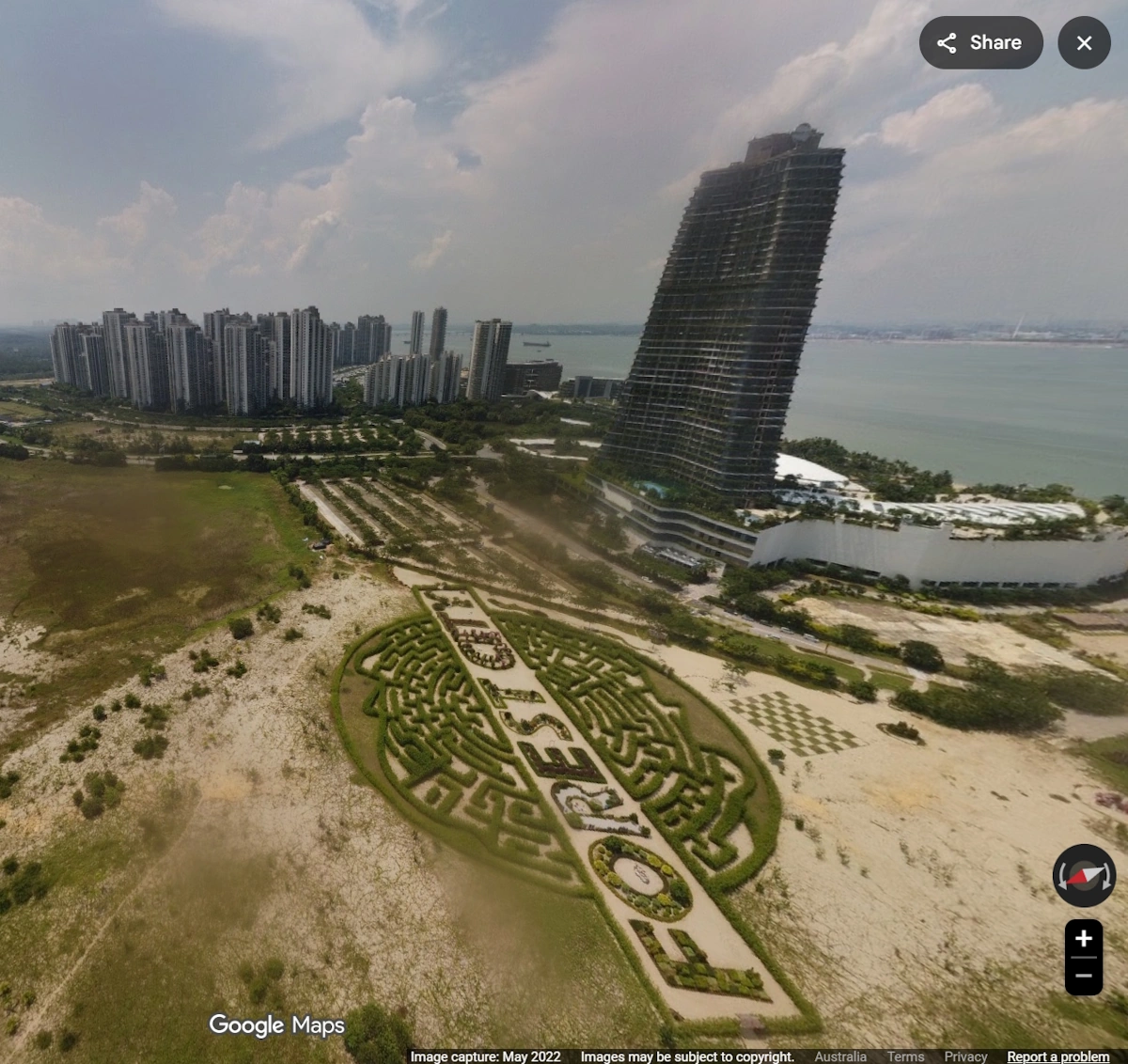 Image showing 3D view of Forest City, including the prominent Carnelian Tower and the high-rise residential towers - Credit: Google Earth