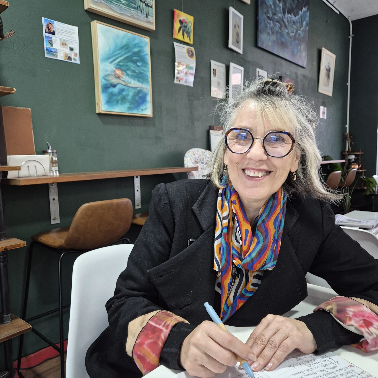 Image of Marlene - Travel Coach - in one of her favorite cafes